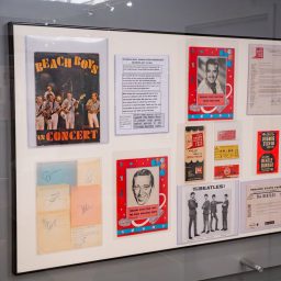 Framed vintage posters on museum wall